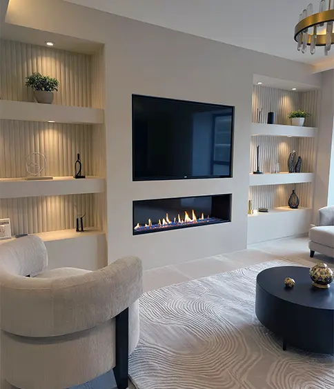 Media wall with mounted TV, electric fireplace and illuminated recessed shelving