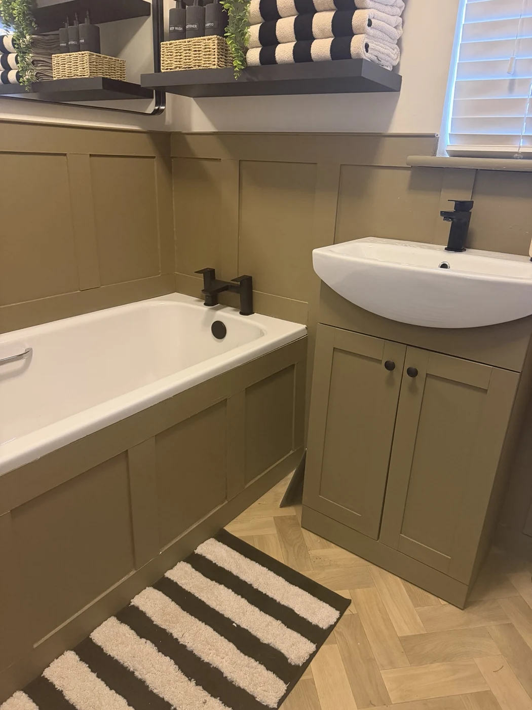 Painted bathroom wall and bath panelling