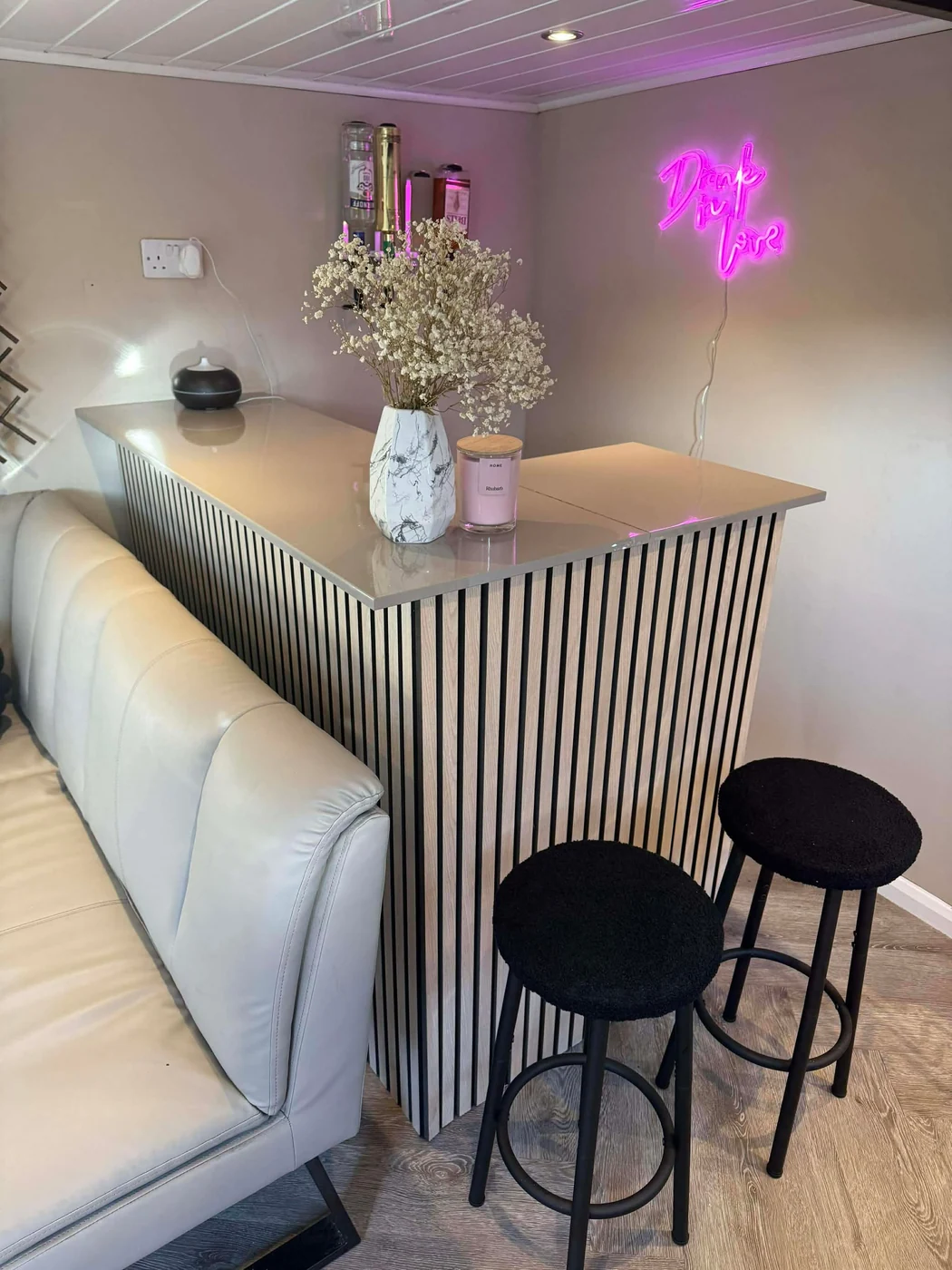 Slatted panelling around a home bar